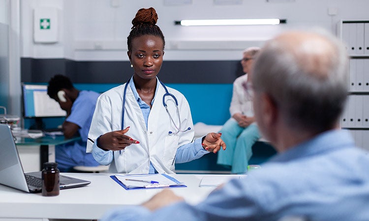 Nurse consulting with patient.