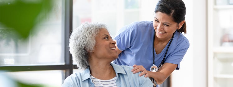 Nurse talking to patient.