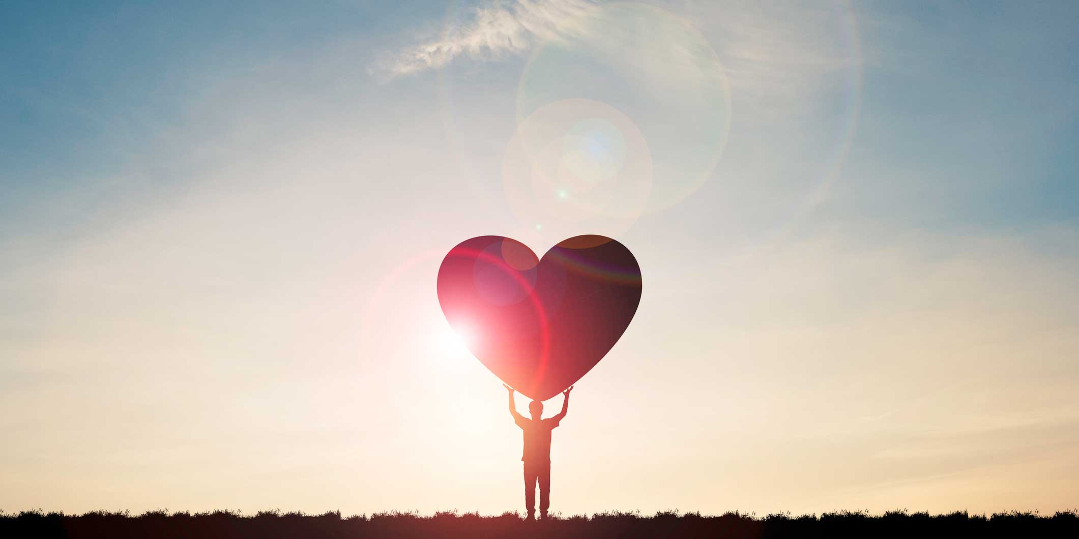 Illustration of a person holding a big red heart.