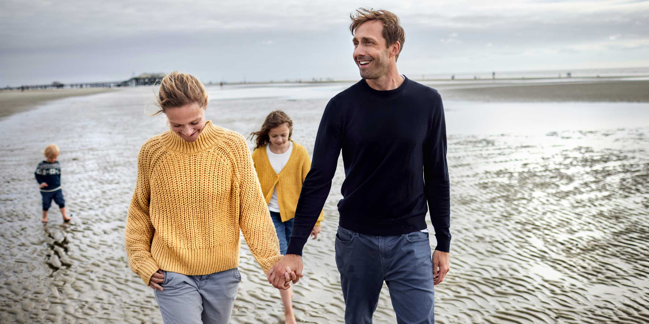 Image of a family walking on the beach.