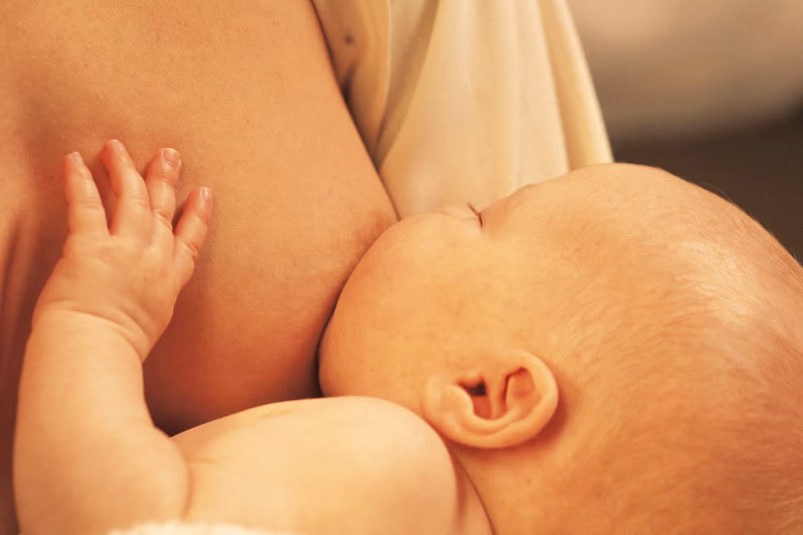 Mother breastfeeding newborn