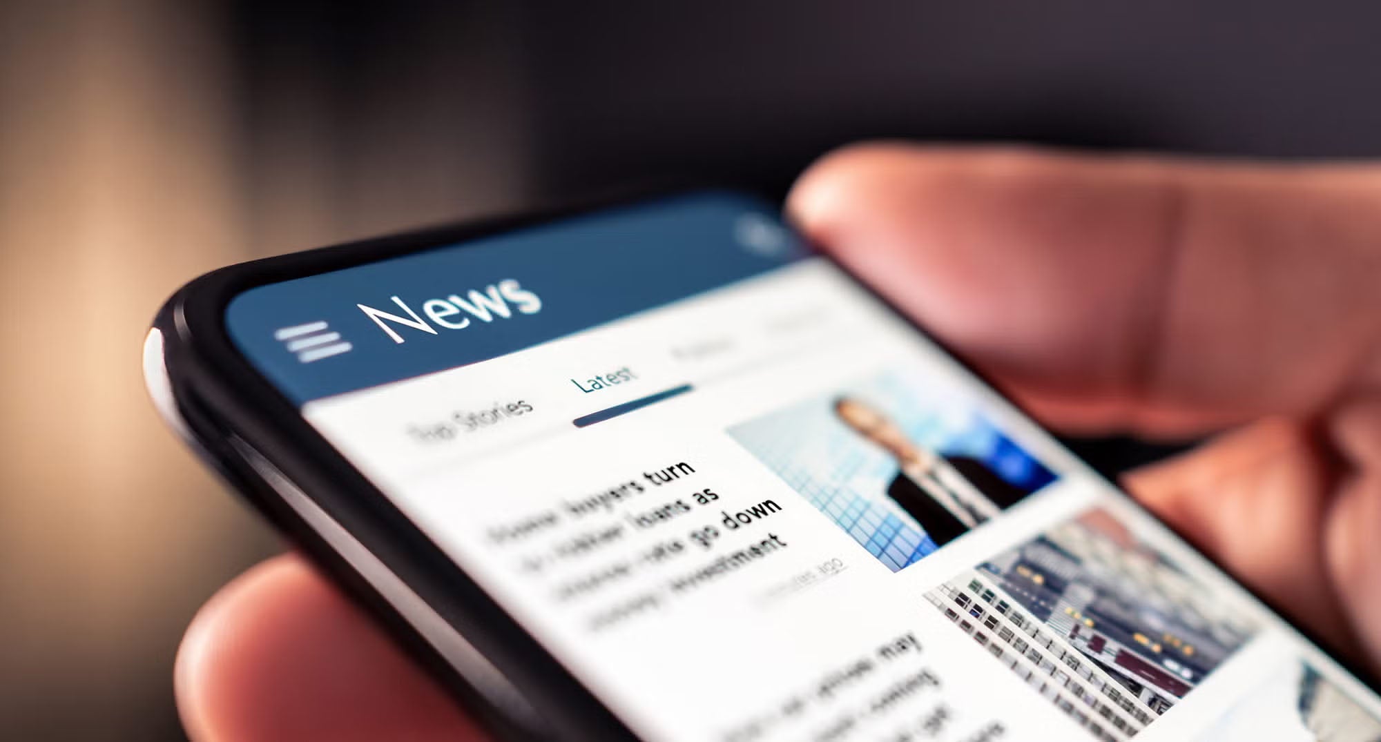 Person viewing news on mobile phone.